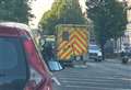 Police and medics block the street after collision between pedestrian and motorbike